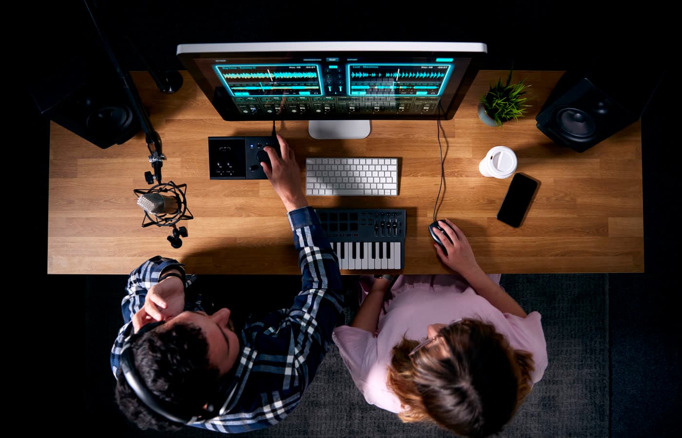 Overhead view of musicians writing together